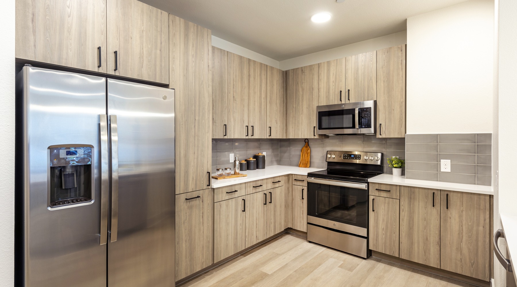 a kitchen with wood cabinets