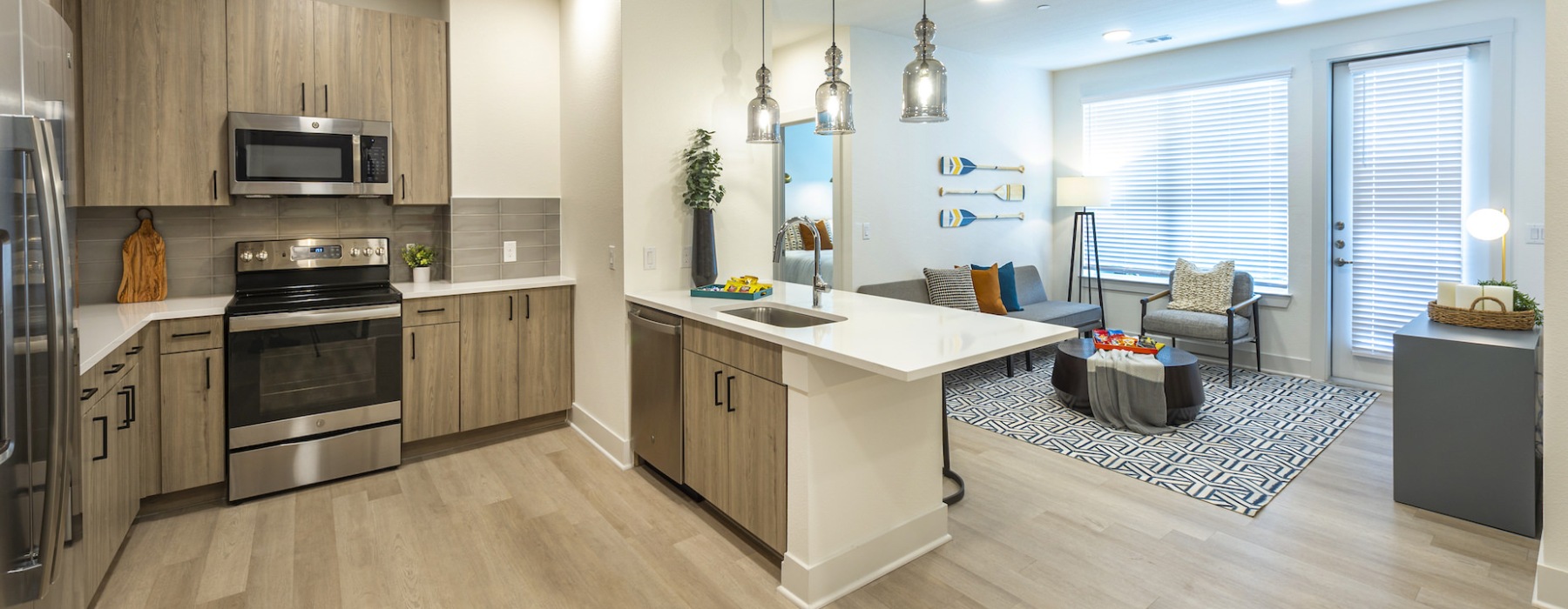 Page Banner c-shaped kitchen with pendant lights over open counter