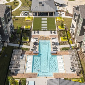 an aerial view of a courtyard with a swimming pool